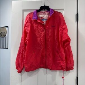 Vintage -style Reebok windbreaker with a pink body and purple collar accents